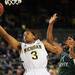 Michigan sophomore Trey Burke takes the ball to the hoop around Cleveland State sophomore Sebastian Douglas during the first half of an NIT Season Tip-Off game at Crisler Center on Tuesday. Melanie Maxwell I AnnArbor.com